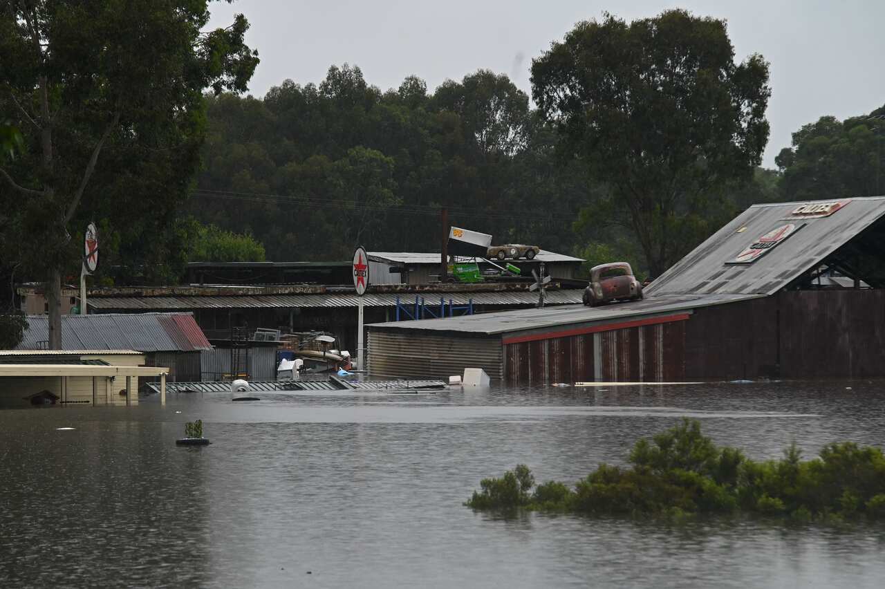 Structures are seen during flooding in Richmond, north west of Sydney, on Monday. 