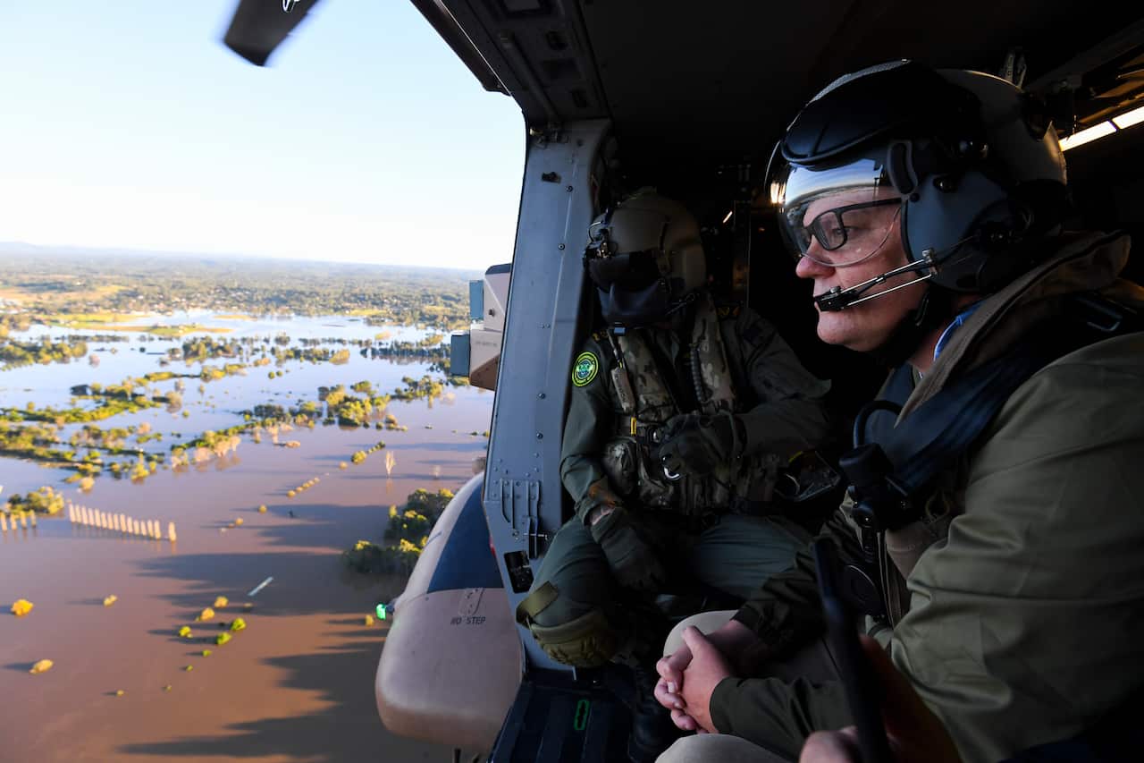 Prime Minister Scott Morrison inspects damage created by floodwaters from a helicopter in Sydney on Wednesday.