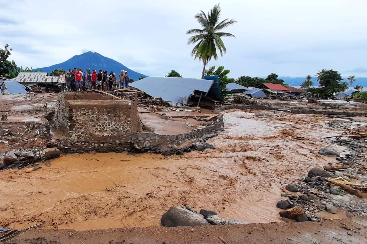 amaged homes after a flash flood in Waiwerang village after a tropical cyclone battered the Southeast Asian nations.