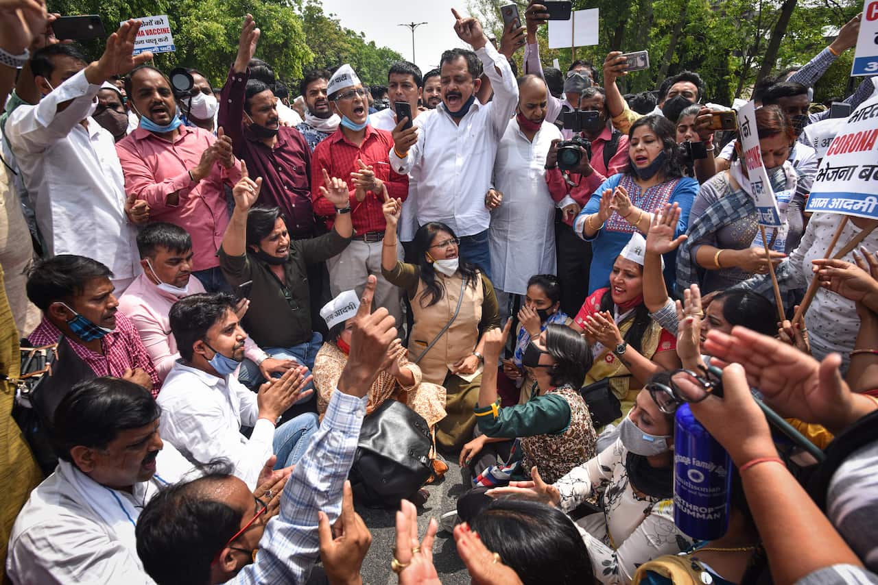 Aam Aadmi Party workers protest against the central government’s age cap for Covid-19 vaccinations which only allows inoculation for people above age 45.