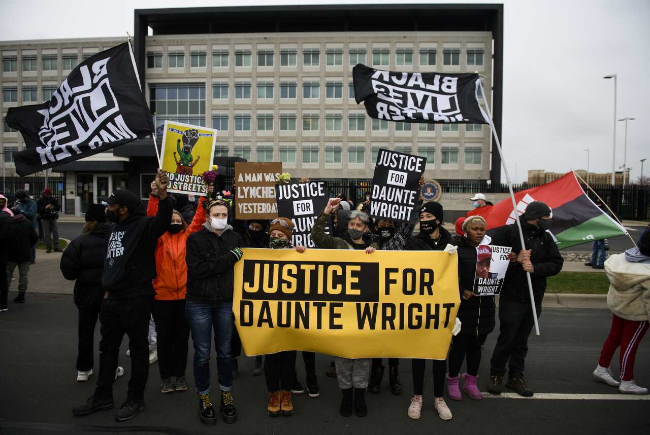 Protesters march from the Brooklyn Center police headquarters to a nearby FBI office on April 13, 2021 in Brooklyn Center, Minnesota.