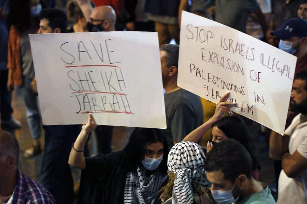 Palestinian protesters march during an anti-Israel demonstration over tension in Jerusalem, near the Jewish settlement of Beit El near Ramallah, in West Bank, on 10 May 2021.