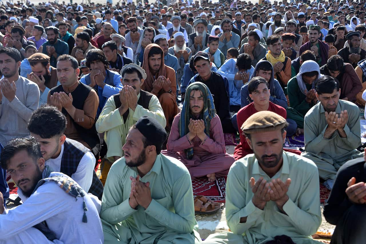 Muslim devotees pray to start the Eid-al-Fitr festival  at a mosque on the outskirts of Jalalabad, Afghanistan, on 13 May, 2021. 