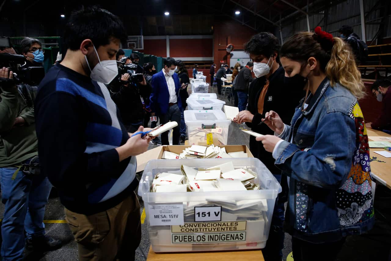 Chilean citizens count votes at the end of the electoral day during the Constitutional Convention Elections weekend on 16 May, 2021 in Santiago.