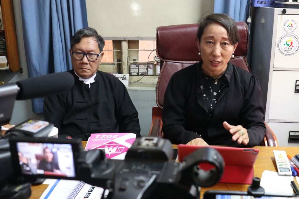Min Min Soe (R) and Khin Maung Zaw (L), lawyers representing detained Myanmar leader Aung San Suu Kyi, address members of the media.