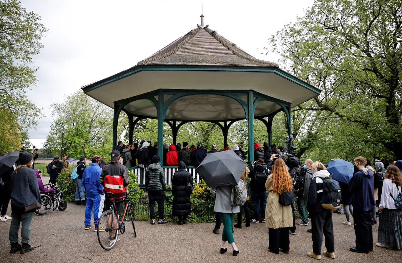 People attend a vigil for activist Sasha Johnson at the bandstand in Ruskin Park in London on 24 May 2021.