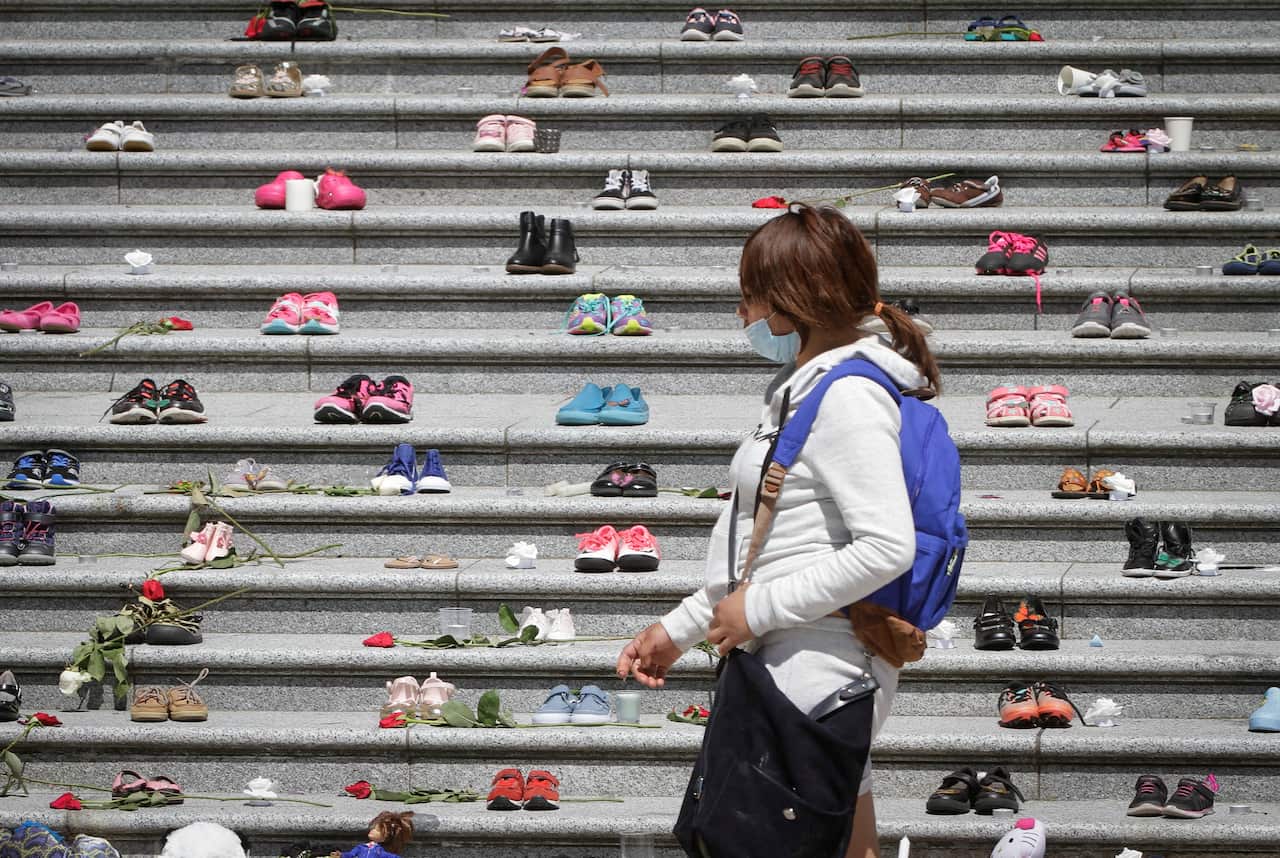 Children's shoes are placed on the staircase outside Vancouver Art Gallery during a memorial event for the 215 children whose remains were found.