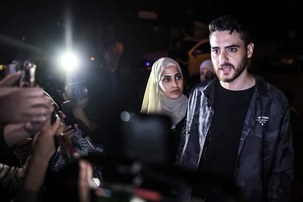 Palestinian activist twins (L to R) Muna and Mohammad el-Kurd, speak to reporters after being released by Israeli authorities on 6 June, 2021. 
