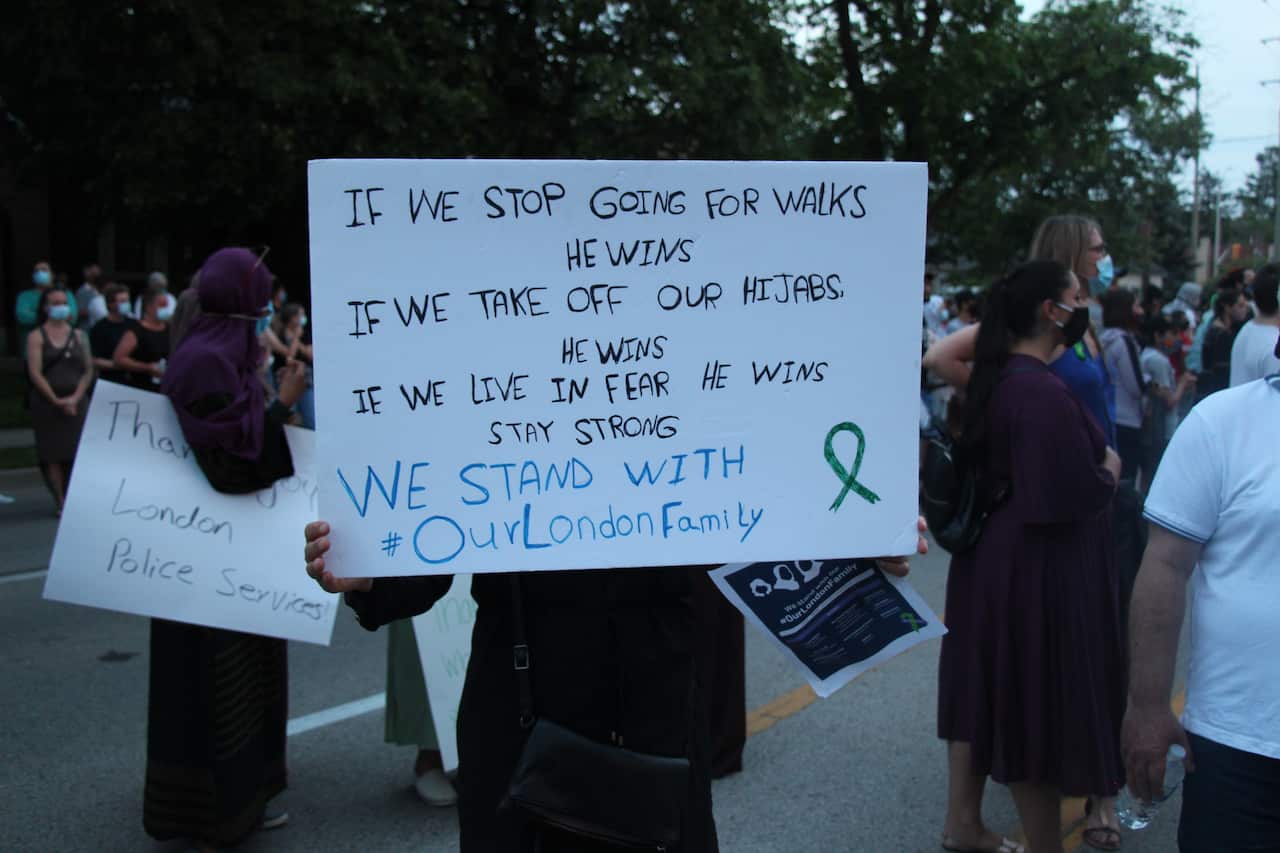 People attend a vigil held for the family killed in London, Ontario, on 8 June 2021.