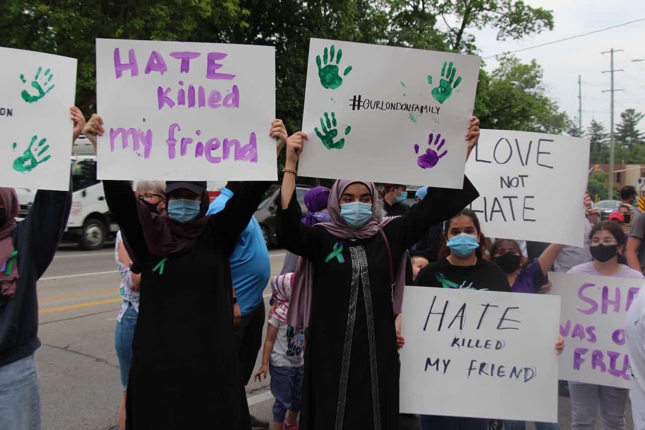 People attend a vigil held for the family in London, Ontario on 8 June, 2021.