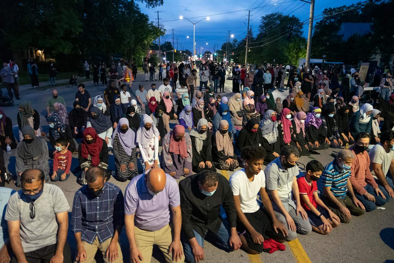Members of the Muslim community gather to pray on Oxford Street on 8 June  in London, Canada, following the vigil held earlier in the day.