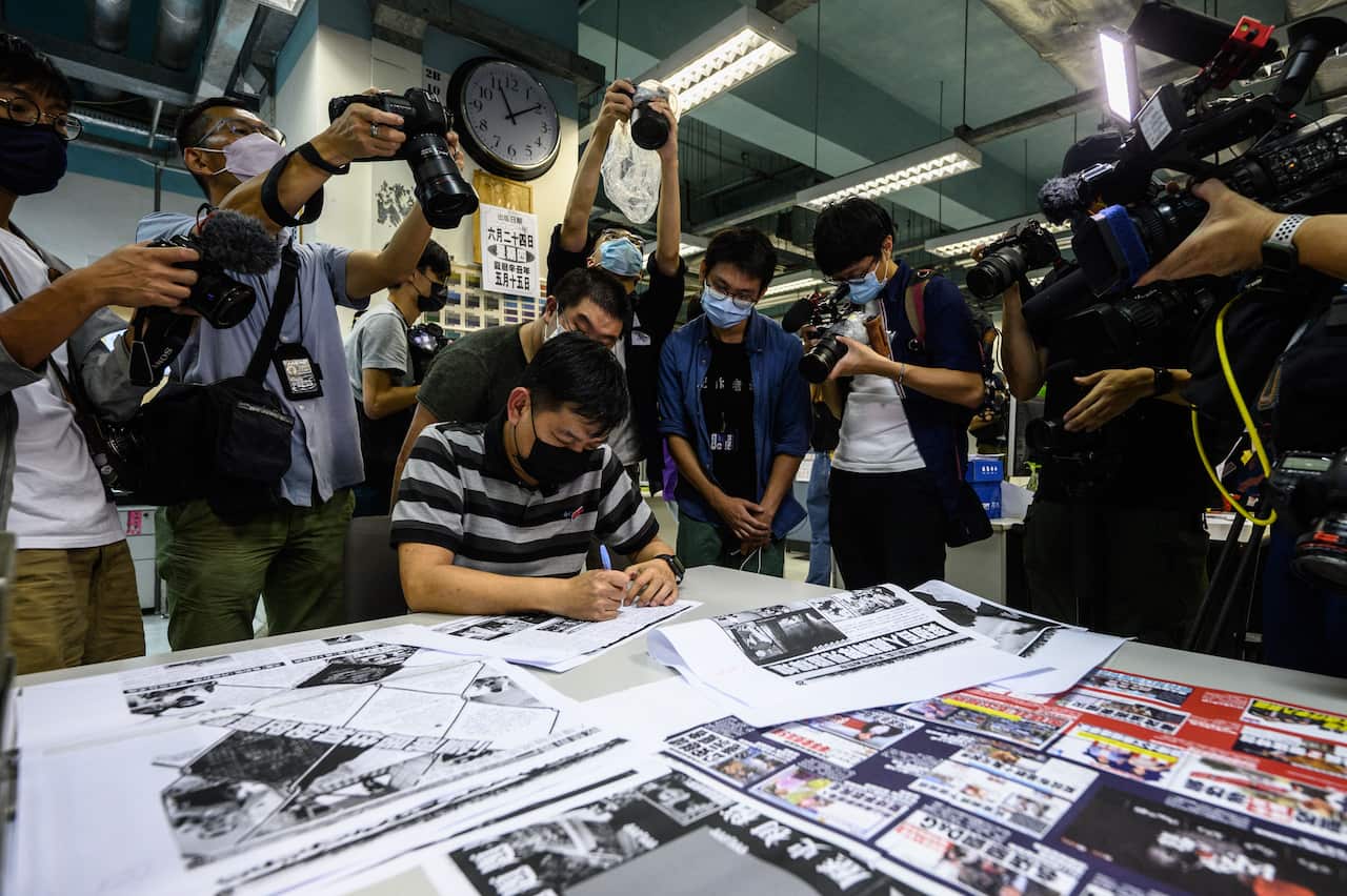 Editor in chief Lam Man-Chung proofreads the next day's 'Apple Daily' newspaper before it goes to print for the last time in Hong Kong, on 23 June.