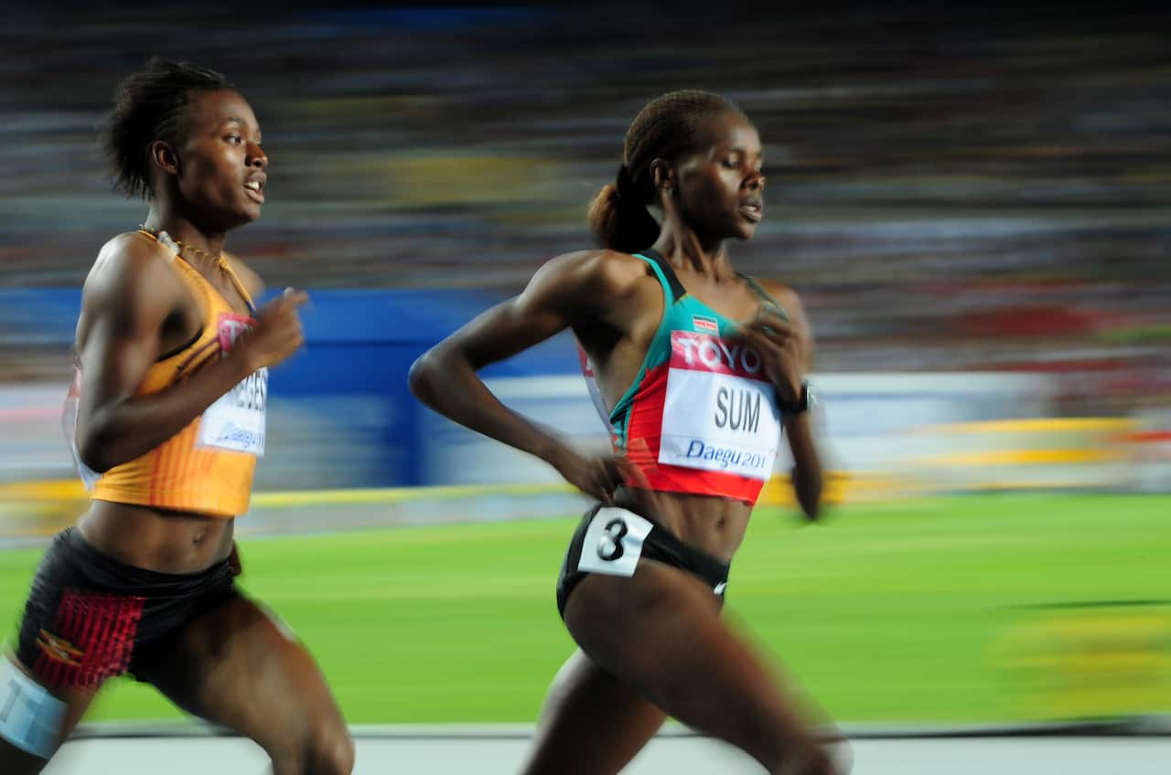 Uganda's Annet Negesa (left) and Kenya's Eunice Jepkoech Sum compete at the International Association of Athletics Federations World Championships in 2011.  