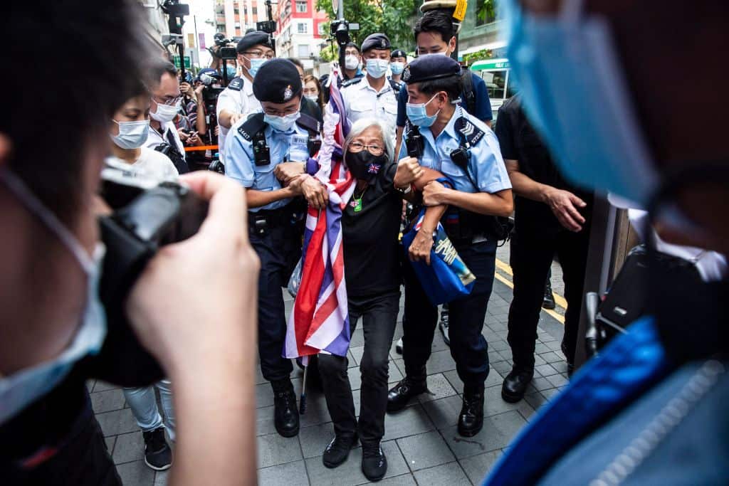 Police take away Activist Alexandra Wong, known as Grandma Wong, on the 24th anniversary of Hong Kong's handover from Britain, in Hong Kong on 1 July, 2021.