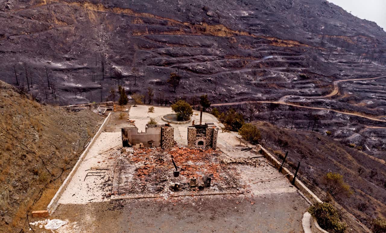 A drone picture taken on 4 July, 2021 shows a destroyed house near Ora village on the southern slopes of the Troodos mountains in Cyprus.