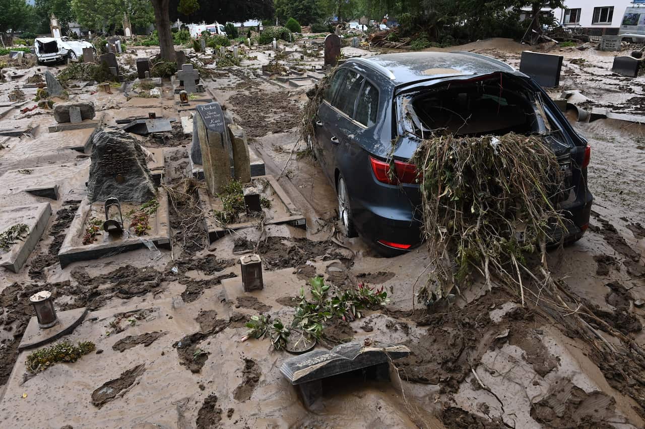 A destroyed car is pictured at a cemetery in Bad Neuenahr-Ahrweiler, western Germany, on 16 July, 2021.