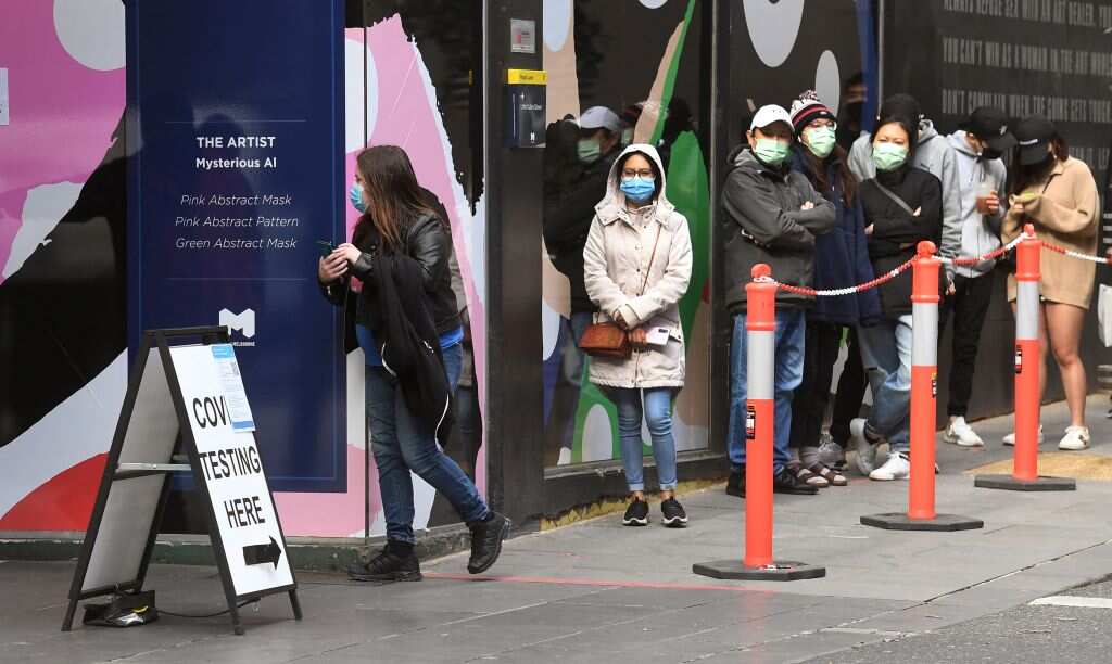 People queue at a Covid-19 coronavirus testing station in Melbourne on 12 August, 2021. 