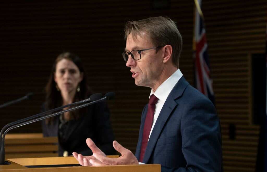 Ashley Bloomfield, chief executive of the Ministry of Health speaks next to New Zealand's Prime Minister Jacinda Ardern in Wellington on 18 August, 2021.