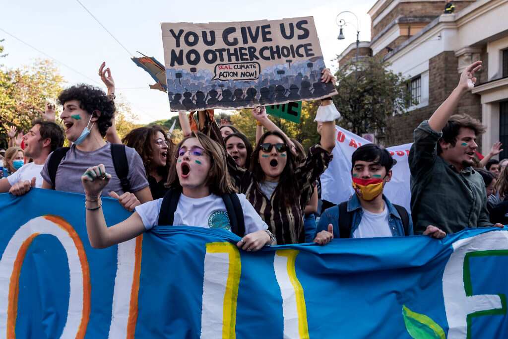 People protest on the sidelines of the G20 of World Leaders Summit taking place on 30 October, 2021 in Rome. 