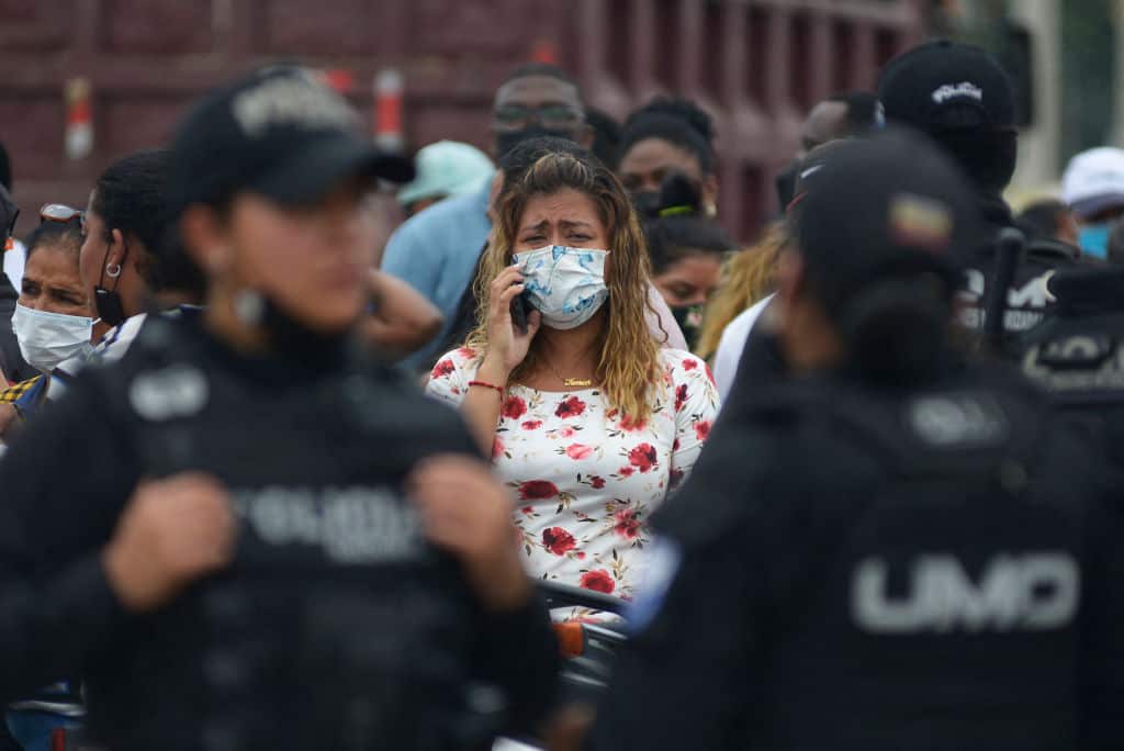 A relative of an inmate cries as she waits for news about her loved one after a riot at the Guayas 1 prison in Guayaquil, Ecuador, on 13 November, 2021. 