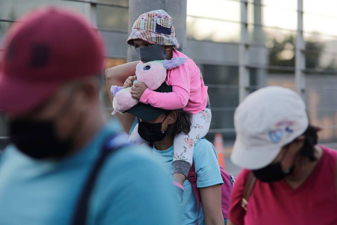 Migrants walk in a caravan in Honduras, aiming to reach the United States. 