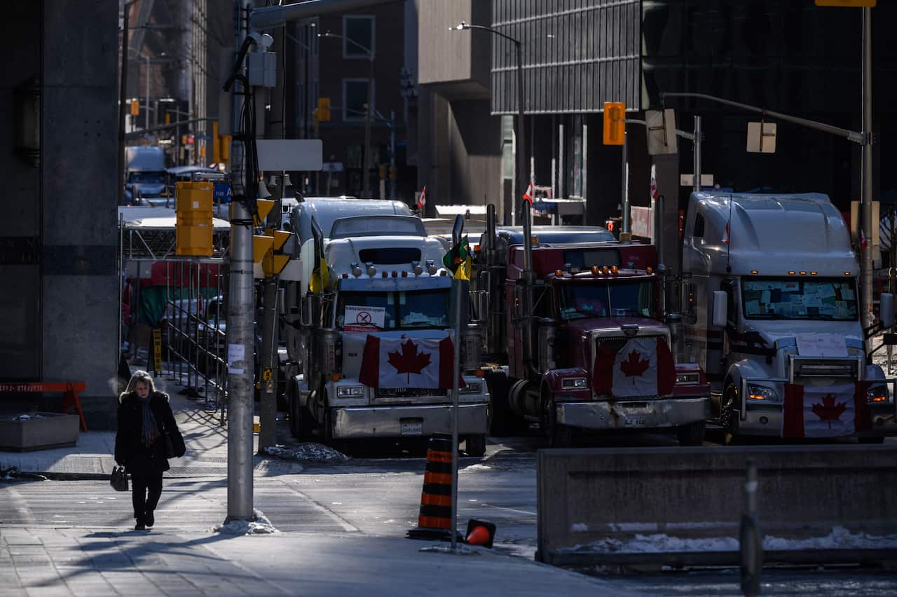 Vehicles block a road during a protest by truck drivers over pandemic health rules and the Trudeau government, outside the parliament of Canada in Ottawa.