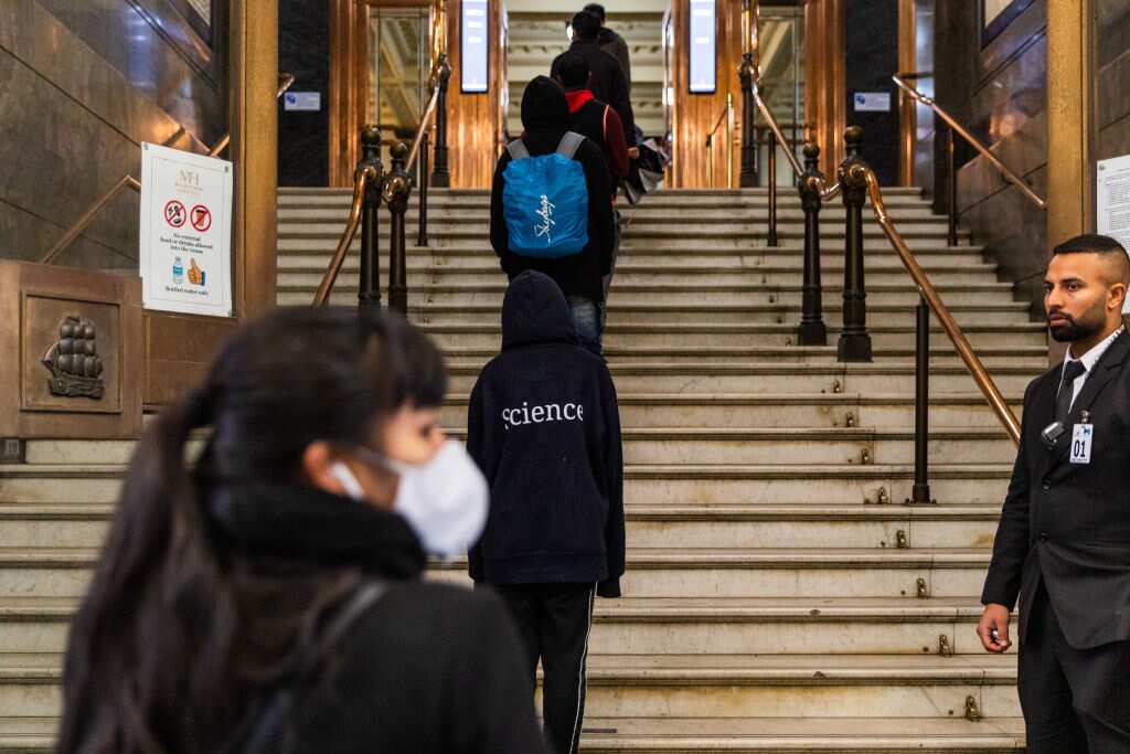 International students line up for food vouchers outside the Melbourne Town Hall.
