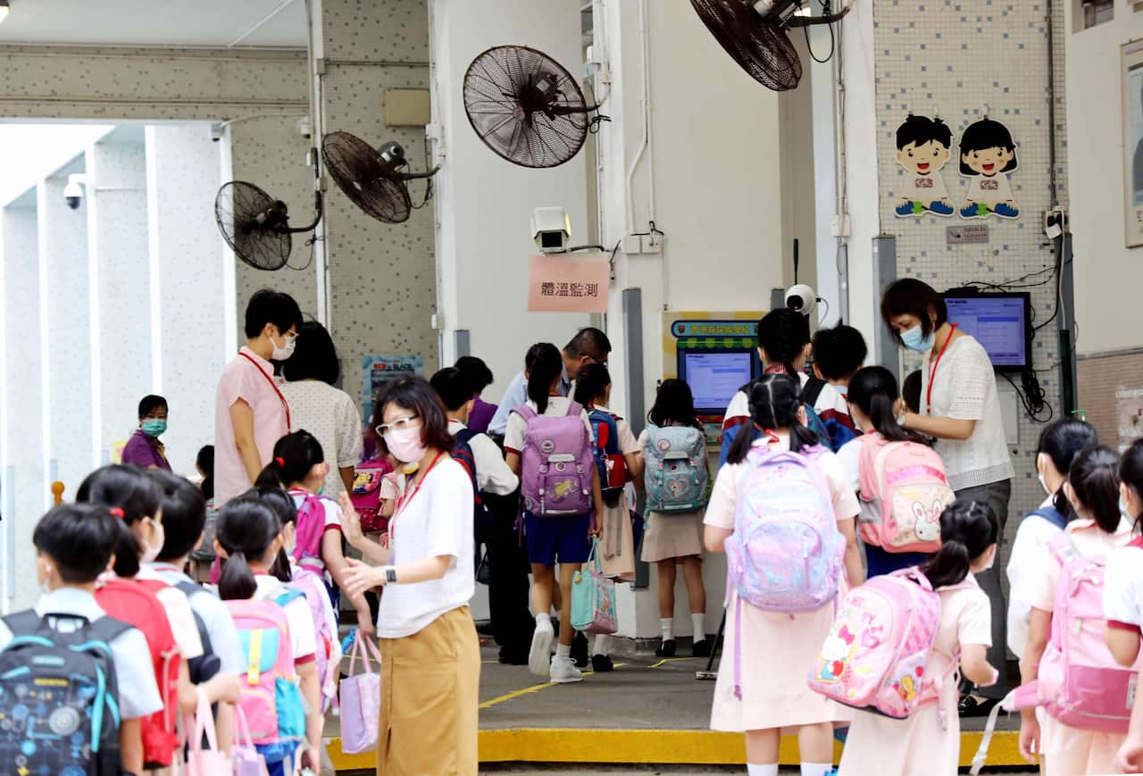 School students having their temperature checked in June.