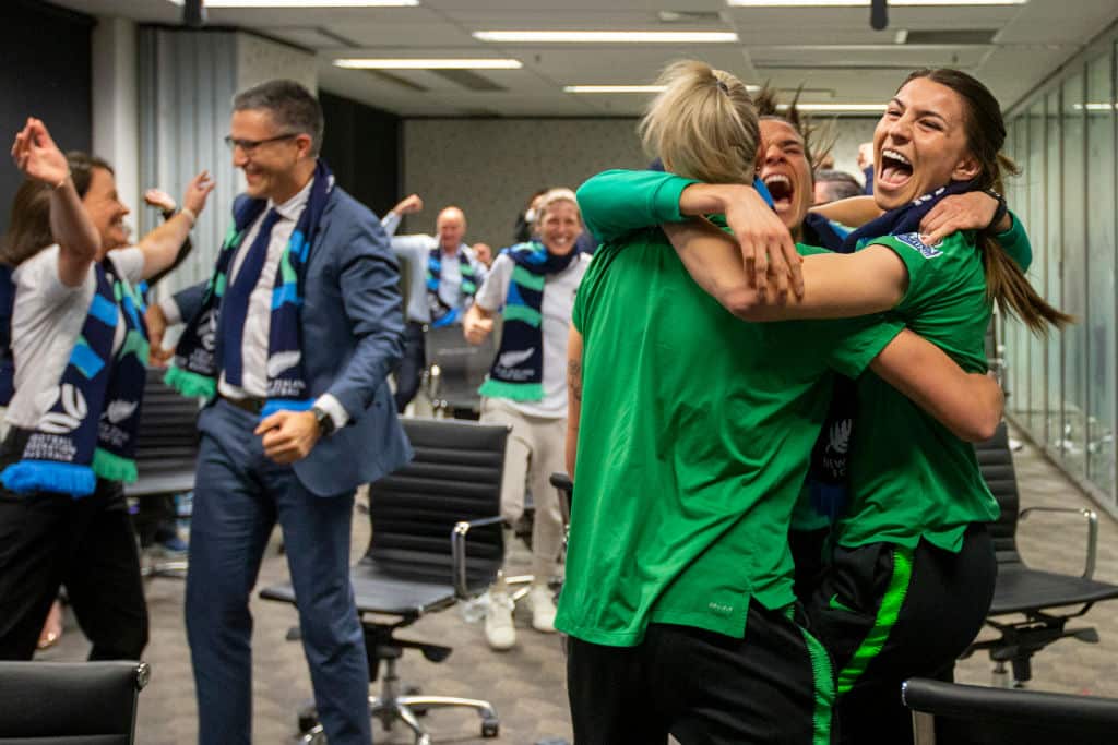 Australian soccer players Steph Catley, Alanna Kennedy and Lydia Williams react as FIFA announced Australia as the hosts to the 2023 FIFA Women's World Cup.
