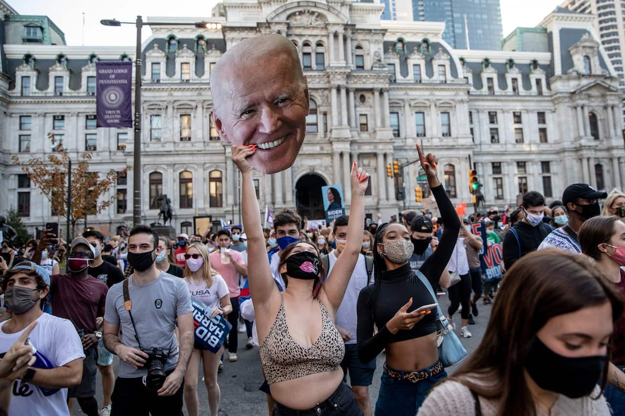 People celebrate outside Philadelphia City Hall after Joe Biden was declared winner of the 2020 presidential election. 