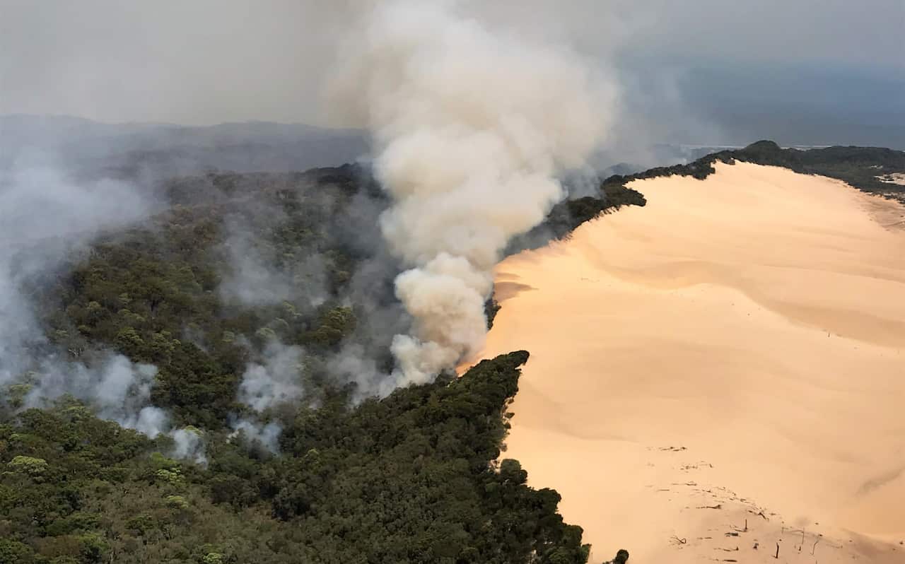 Residents have been told to leave immediately as bushfire is expected to impact Fraser Island's Happy Valley community.