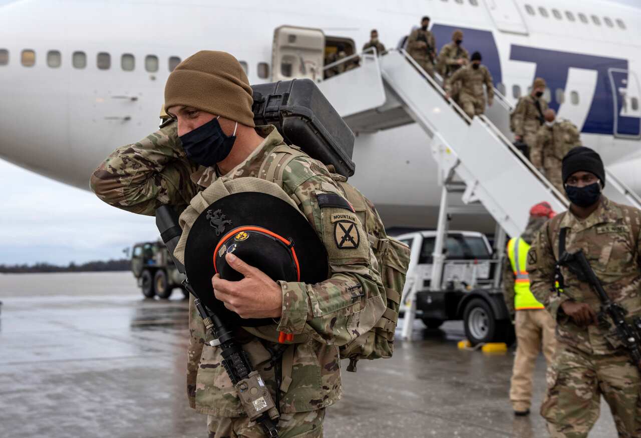 US Army soldiers return home from a nine-month deployment to Afghanistan on 10 December, 2020 at Fort Drum, New York. 