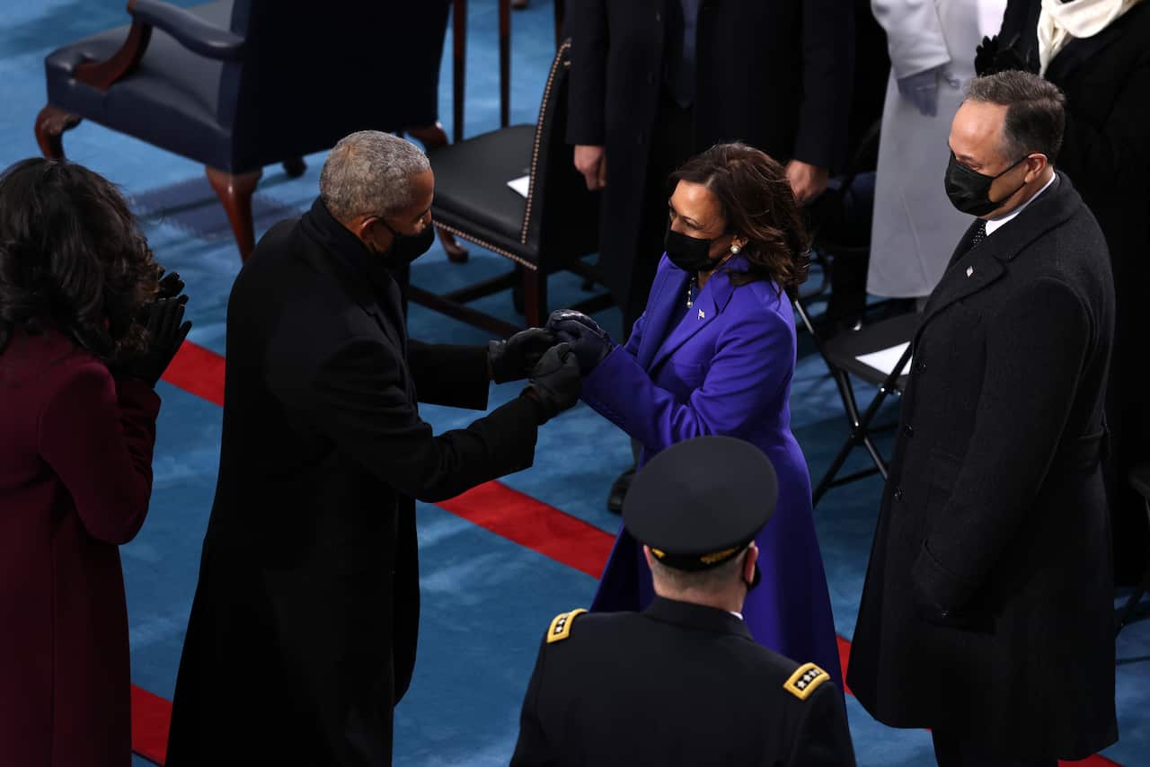 Kamala Harris and husband Doug Emhoff greet former president Barack Obama and Michelle Obama.