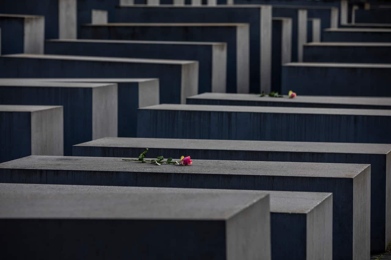 Roses are placed on the Holocaust Memorial in Berlin, Germany, on International Holocaust Remembrance Day on 27 January, 2021.