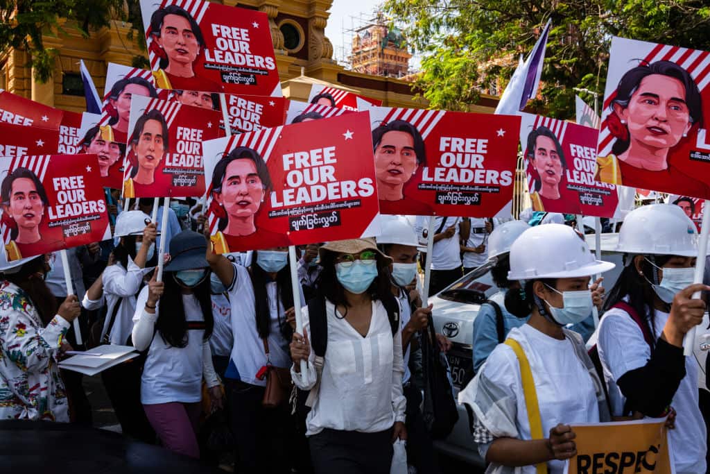 Protesters take part in an anti-coup march on 14 February 2021 in Yangon, Myanmar.
