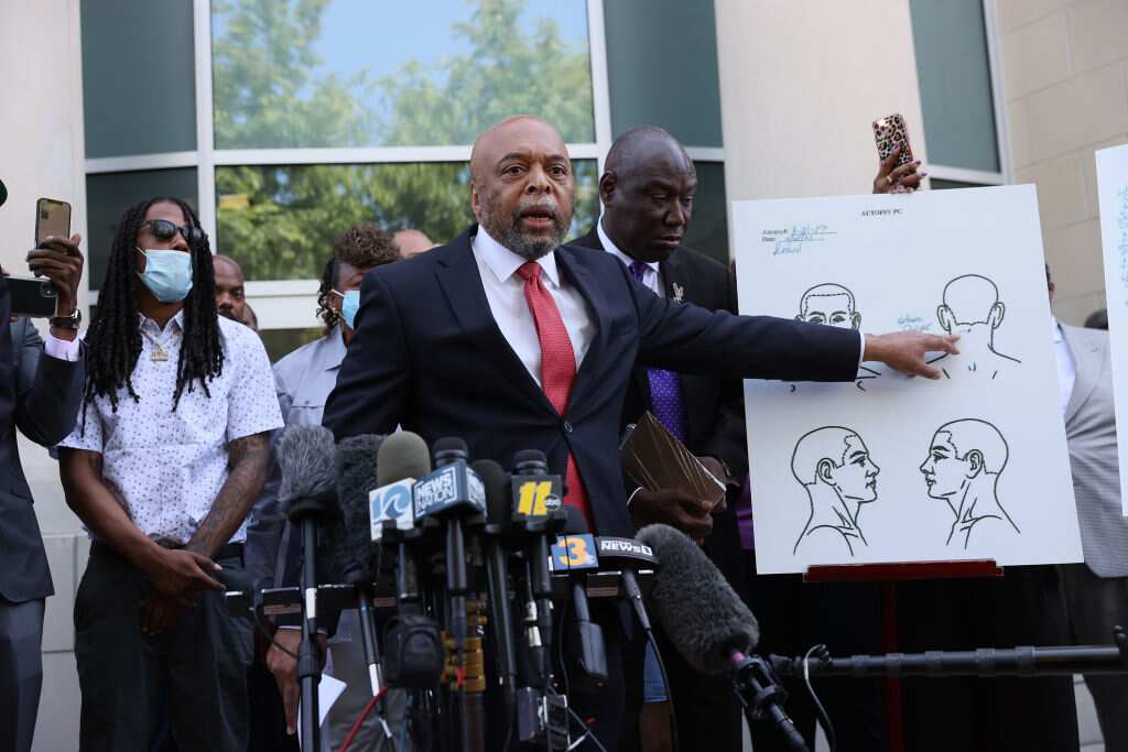 Wayne Kendall, one of the lawyers representing the family of Andrew Brown Jr., points to an autopsy chart showing where Mr Brown was shot by police.