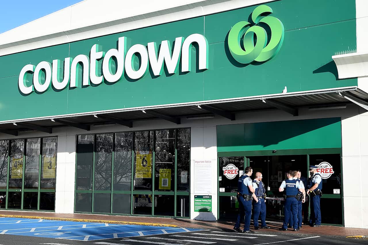 Police officers are observed outside the main entrance of the Dunedin Central Countdown on 10 May, 2021 in Dunedin, New Zealand.