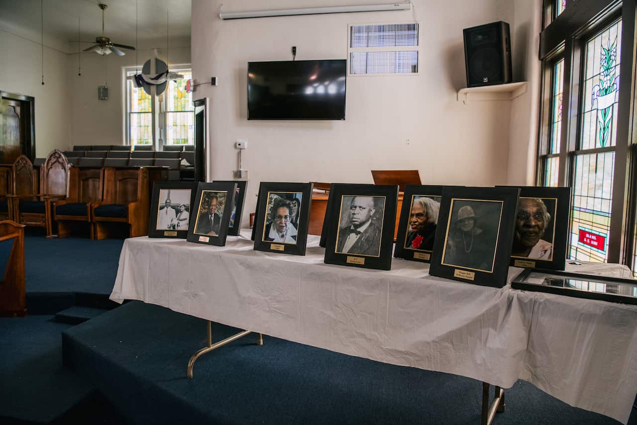 Pictures of parishioners from the AME Church congregation are displayed during commemorations of the 100th anniversary of the Tulsa Race Massacre.