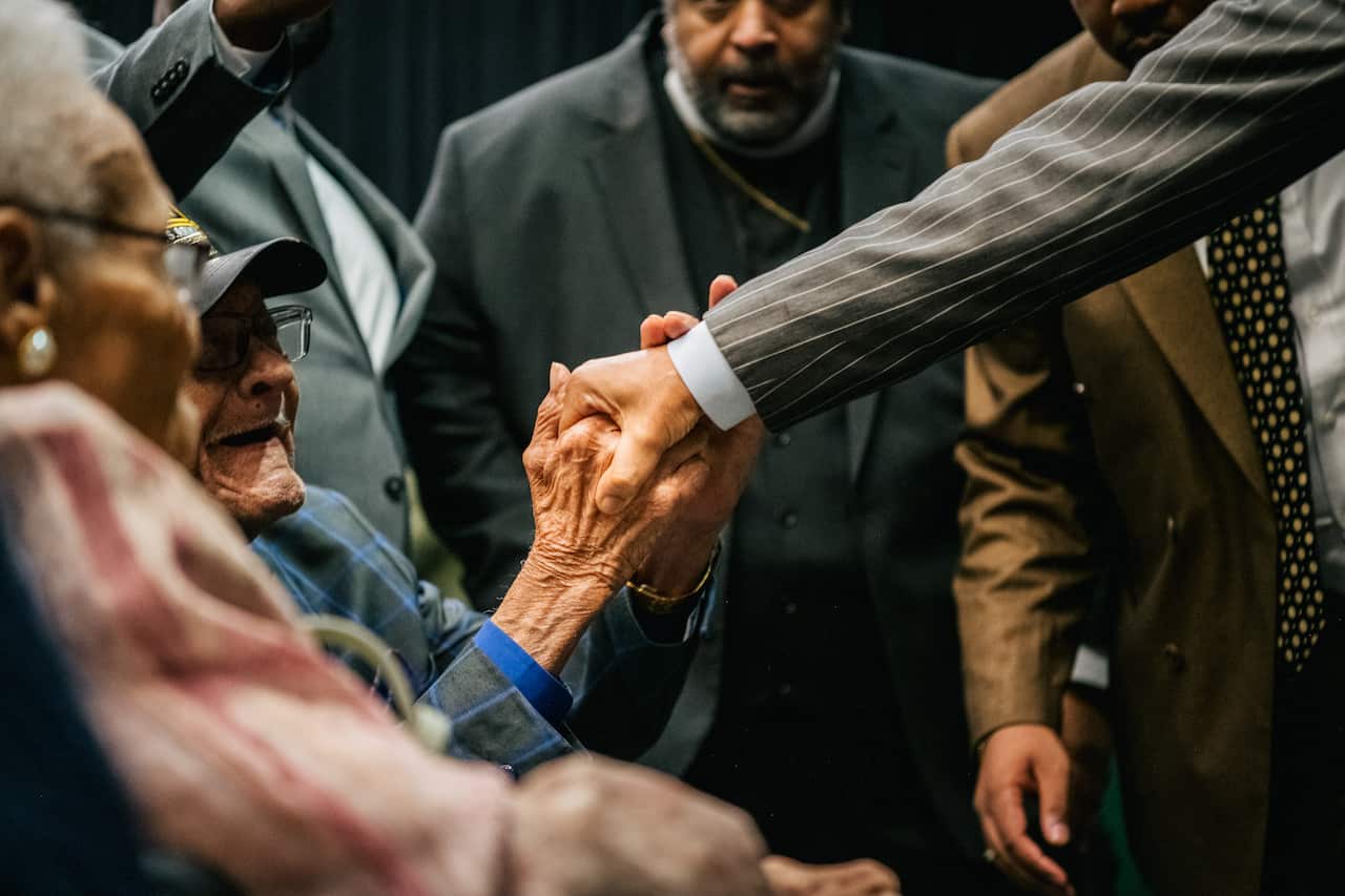 Survivor Hughes Van Ellis is greeted by Rev. Al Sharpton at a rally during commemorations of the 100th anniversary of the Tulsa Race Massacre on 1 June, 2021.