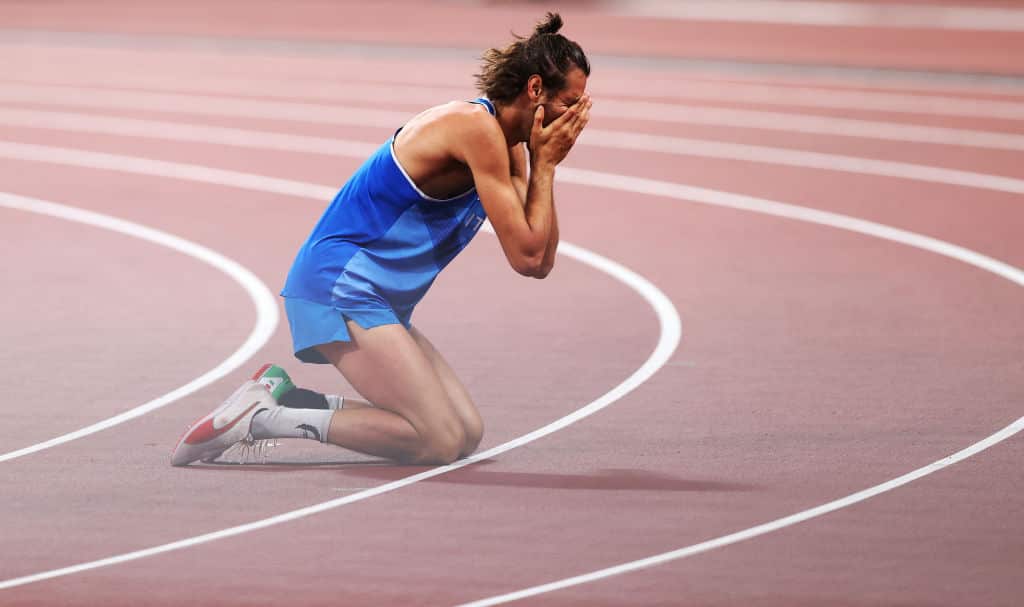 Gianmarco Tamberi of Italy celebrates sharing the gold medal with Muta Essa Barshim of Qatar in the High Jump on day nine of the Tokyo 2020 Olympic Games. 