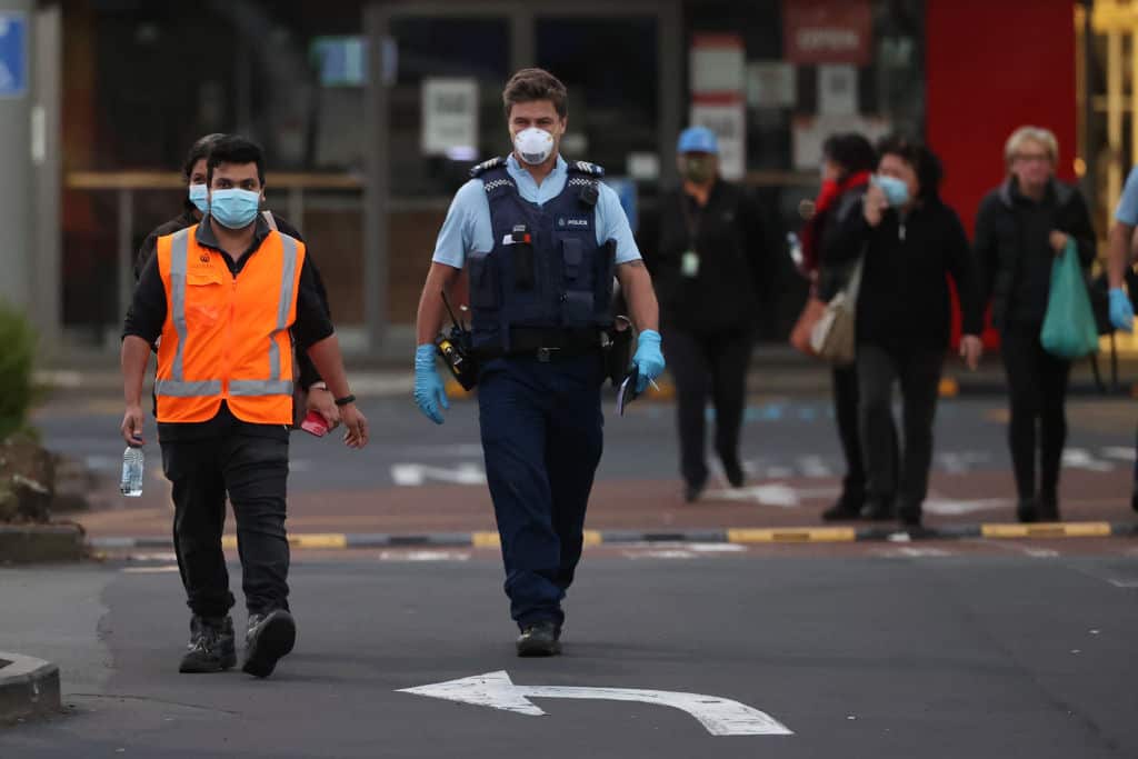 Police escort people from LynnMall to their cars on 3 September , 2021 in Auckland, New Zealand.
