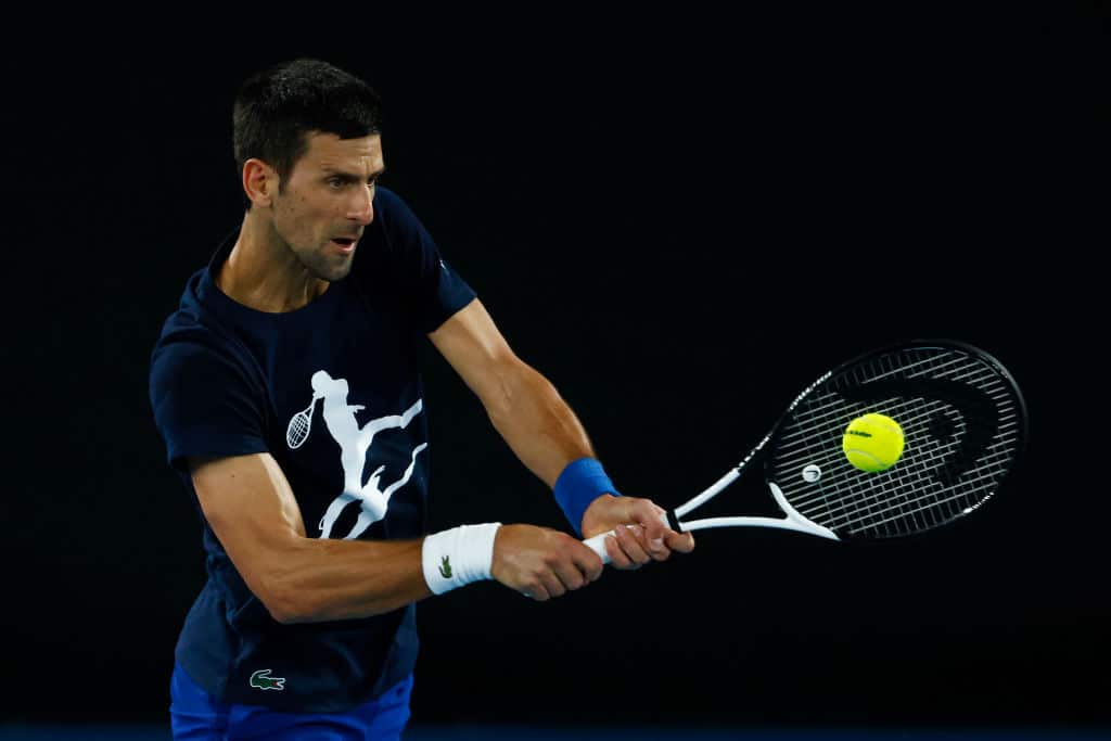 Novak Djokovic plays a backhand during a practice session ahead of the 2022 Australian Open at Melbourne Park on 14 January 2022.