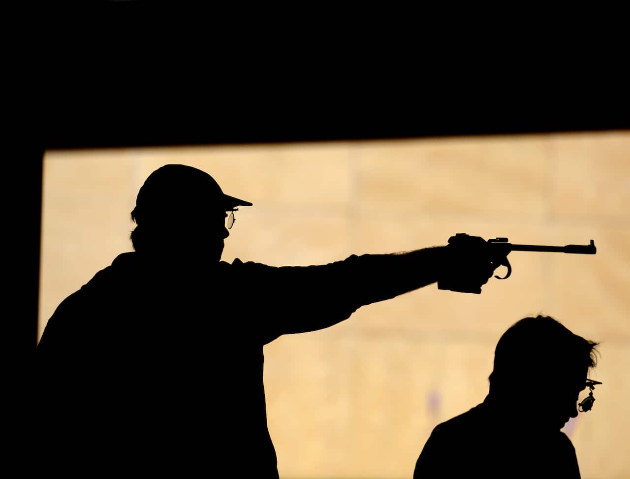 A professional Australian shooter competes in the Olympics
