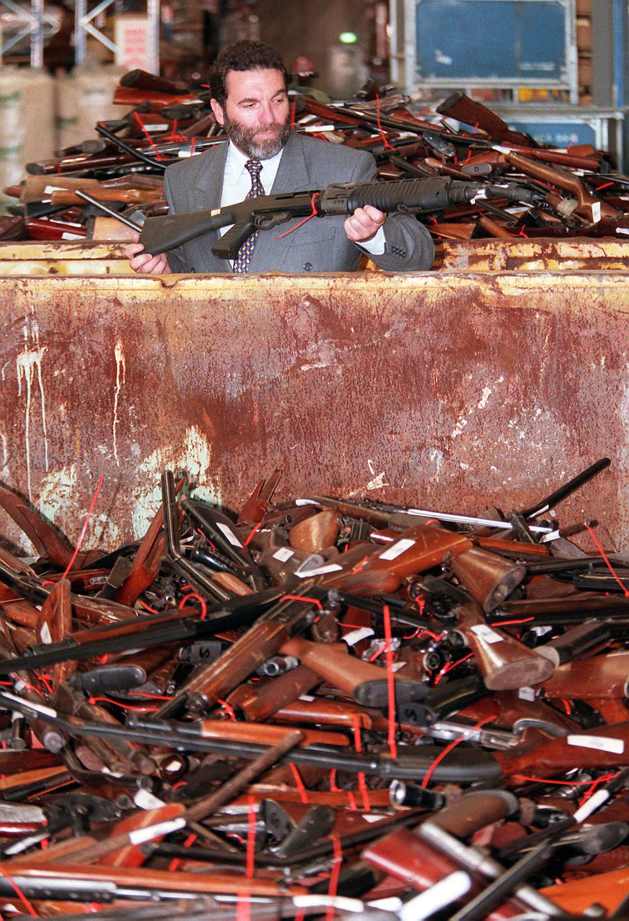 Man holds surrendered gun in amnesty 