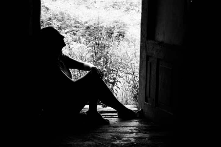 silhouette of a woman in doorway (shot in b/w)