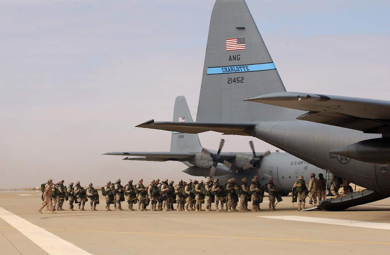 US paratroopers from the 82nd Airborne Division enter a C-130 transport plane at the al-Asad airbase, northwest of Baghdad in 2004.