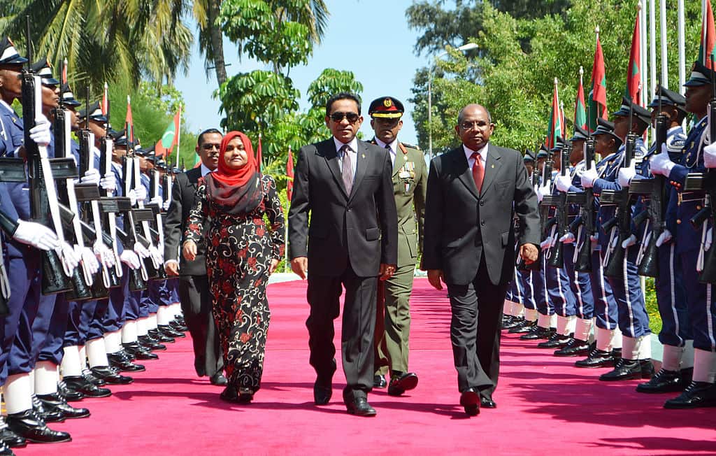 Maldivian President Abdulla Yameen walks past armed guards during a swearing in ceremony in Male on November 17, 2013 (STRDEL / AFP / Getty Images).