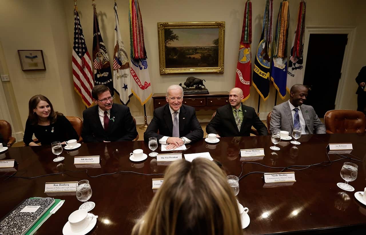 Jeremy Richman sits to the left of former vice president Joe Biden at a White House meeting.