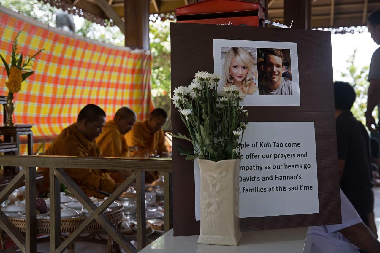 Buddhist monks reciting prayers during a religious ceremony held in memory of Ms. Witheridge and Mr. Miller in 2014.