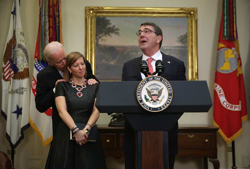 At the ceremony of Ash Carter, Defense Secretary, in 2015, Joe Biden put his hands on the shoulders of Stephanie Carter and whispered into her ear.